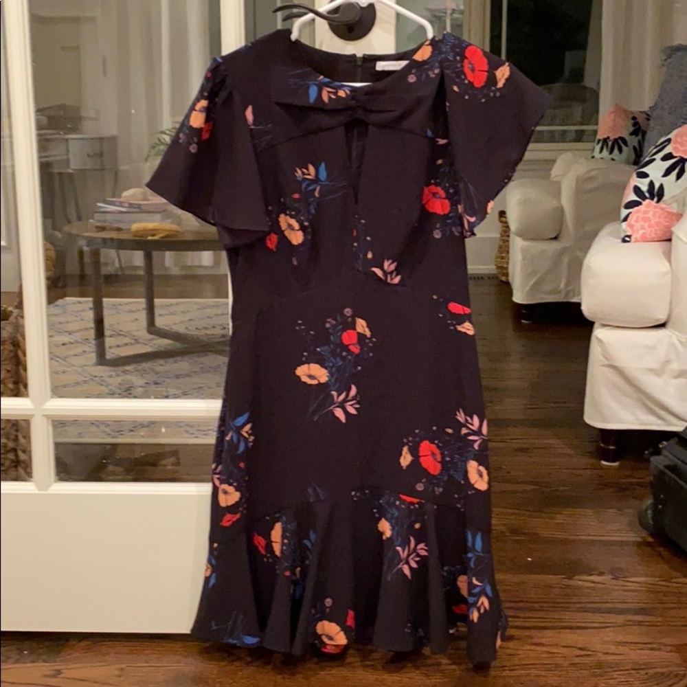 Short black dress.  floral detail.